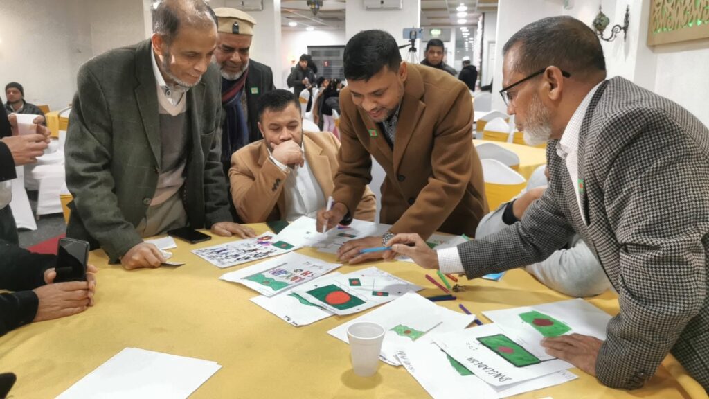 A judge reviews the children's artwork during the art competition at the JPS Victory Day celebration.