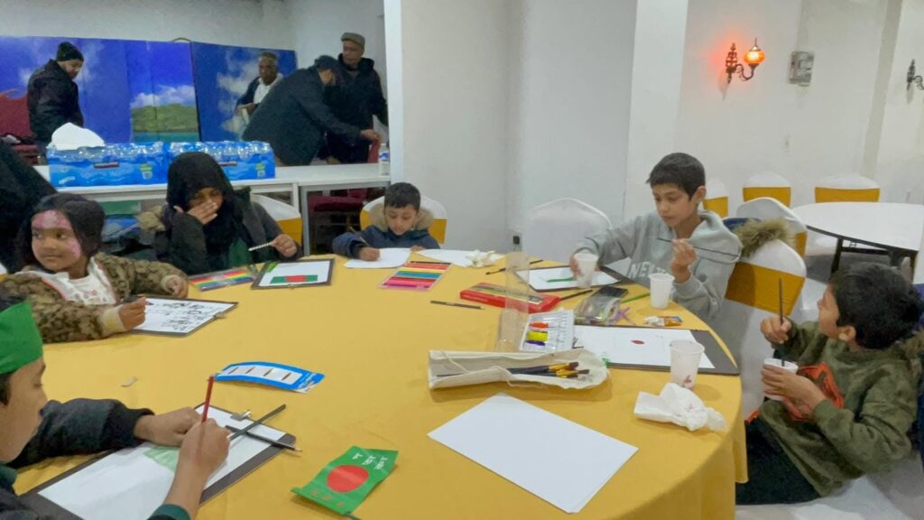 Children taking part in the art competition at the JPS Victory Day of Bangladesh celebration.