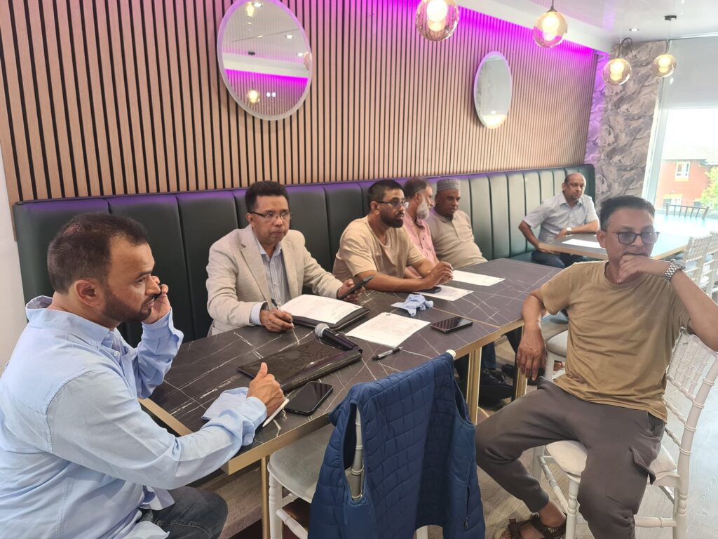 Attendees at the Jagannathpur Probashi Shongo Biennial General Meeting 2026, Uzan Vati Restaurant, Oldham.