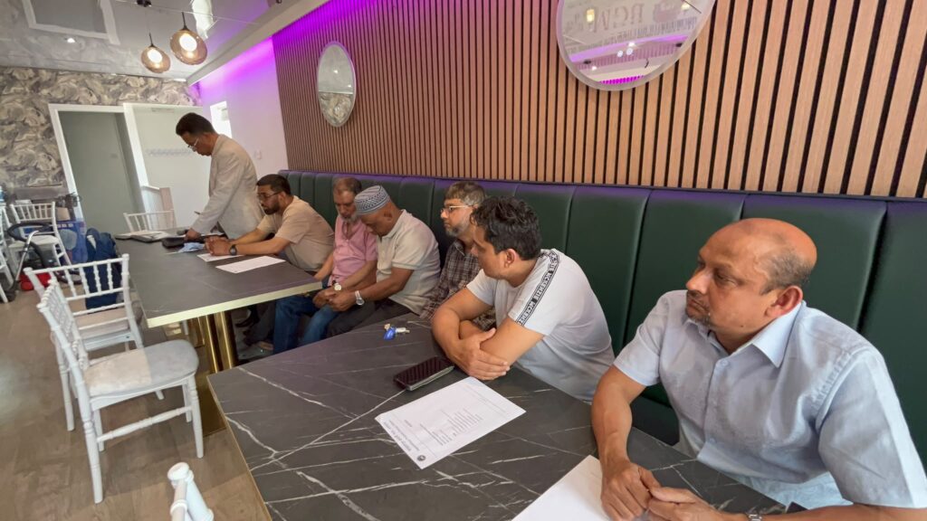 Attendees at the Jagannathpur Probashi Shongo Biennial General Meeting 2026, Uzan Vati Restaurant, Oldham.